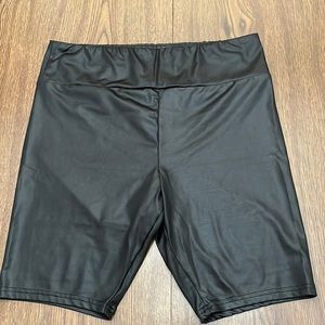 Black biker shorts. Fake leather looking.